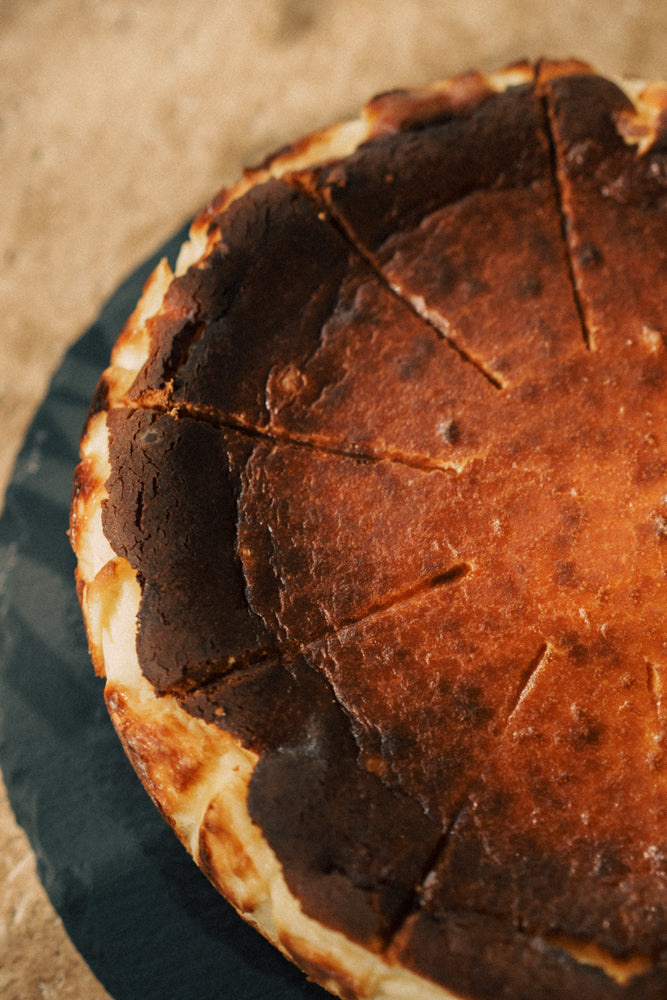 Close-up of a pie with a brown crust on a wooden surface